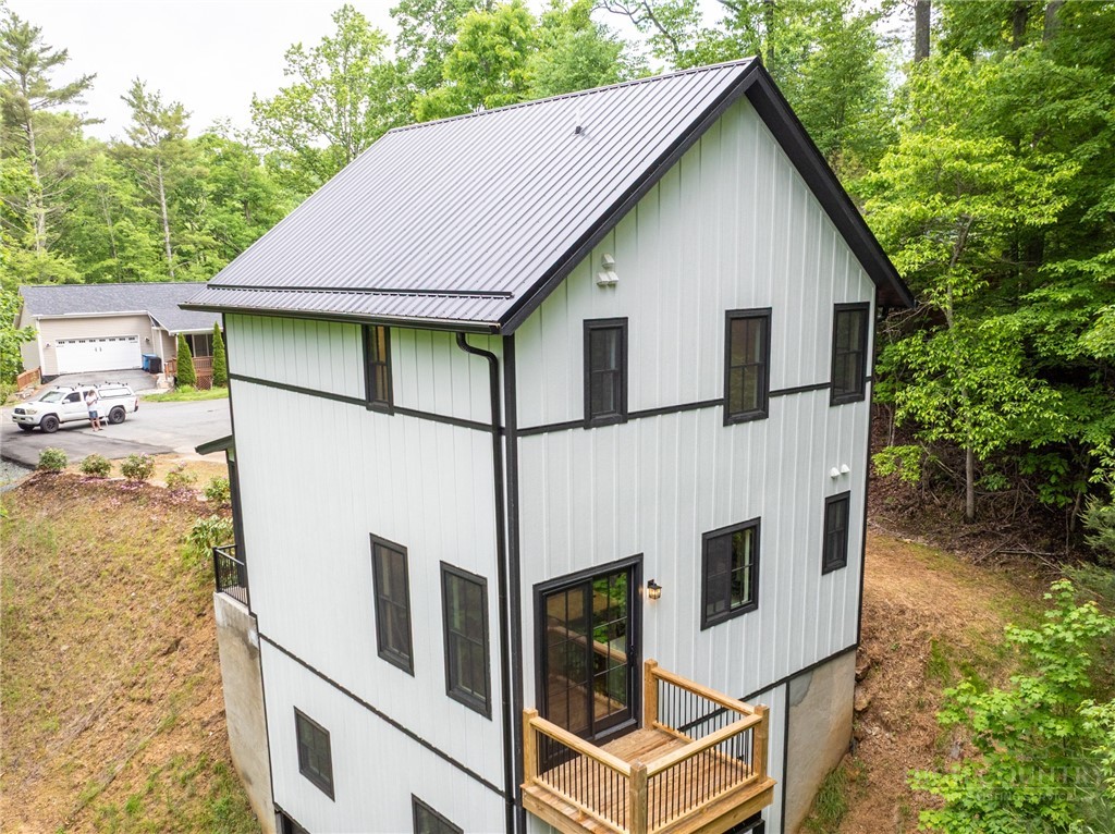 131 Bryce Way Boone, NC 28607 - Photo 33 of 38 a view of a white house with large windows
