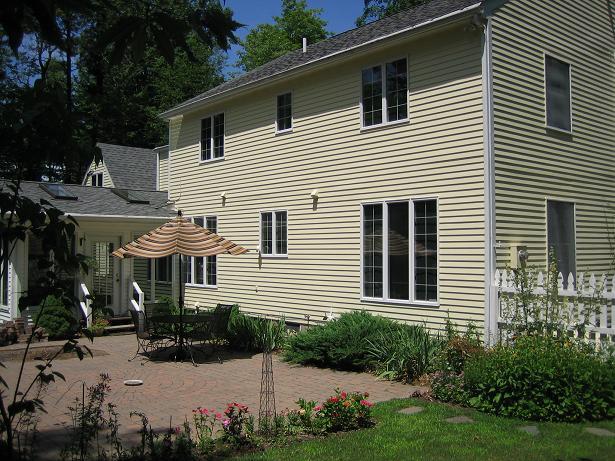 2514 Ridge Circle Cresco, PA 18326 - Photo 11 of 13 a view of a white house with a yard and potted plants
