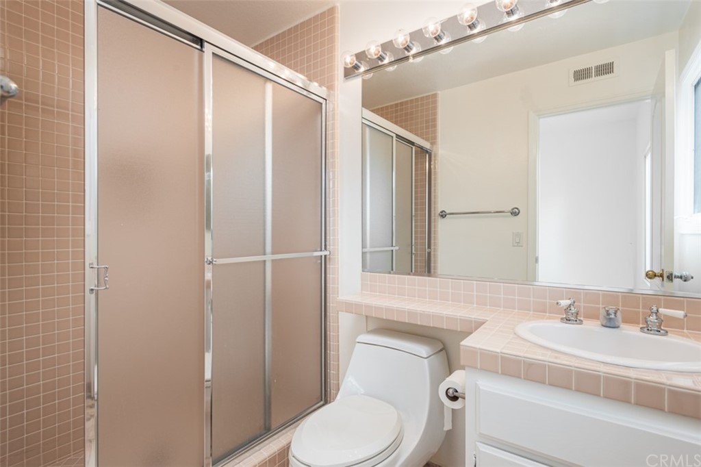 23 Summerside Coto de Caza, CA 92679 - Photo 13 of 34 a bathroom with a granite countertop sink a toilet and a mirror