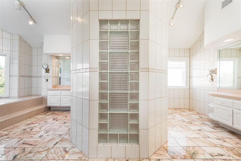 23 Summerside Coto de Caza, CA 92679 - Photo 18 of 34 a bathroom with a tub sink and mirror