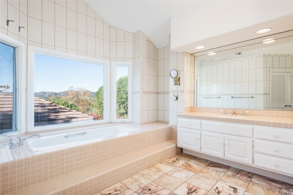 23 Summerside Coto de Caza, CA 92679 - Photo 19 of 34 a bathroom with a shower and a sink