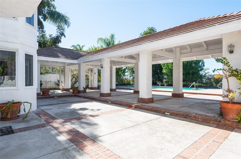 23 Summerside Coto de Caza, CA 92679 - Photo 31 of 34 a front view of a house with swimming pool having outdoor seating