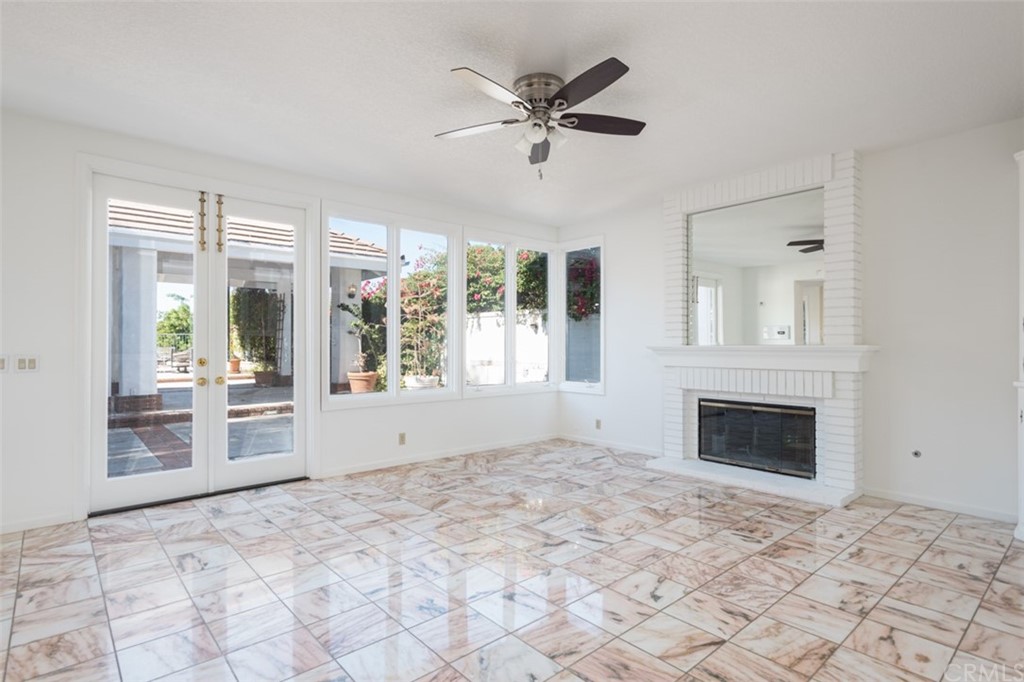 23 Summerside Coto de Caza, CA 92679 - Photo 6 of 34 a view of an empty room with a fireplace and a window