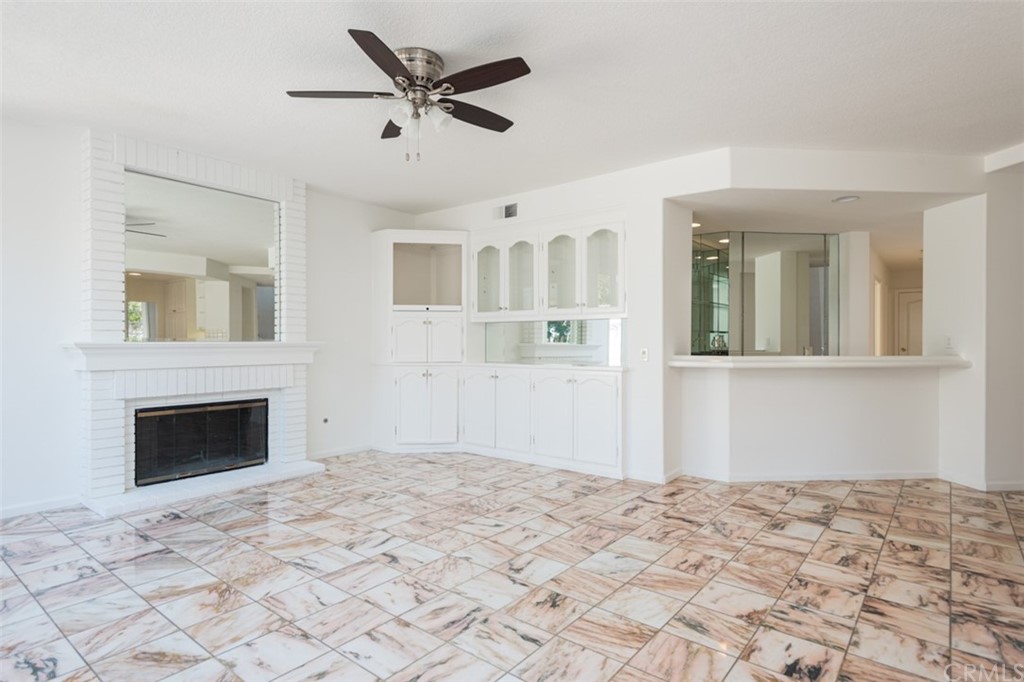 23 Summerside Coto de Caza, CA 92679 - Photo 7 of 34 a bedroom with bed and fireplace