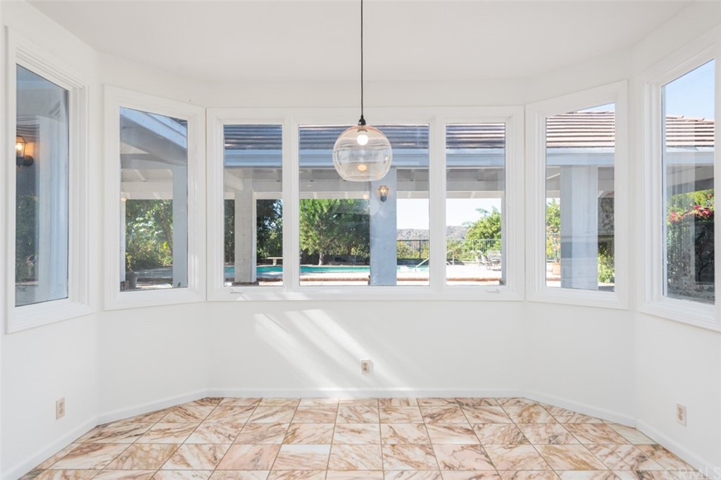 23 Summerside Coto de Caza, CA 92679 - Photo 10 of 34 a front view of a house with a large window and chandelier