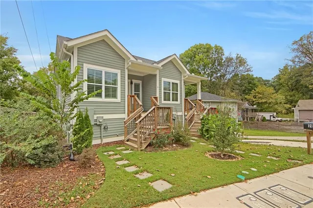 a front view of a house with garden