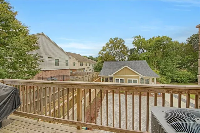 a view of a street with wooden fence
