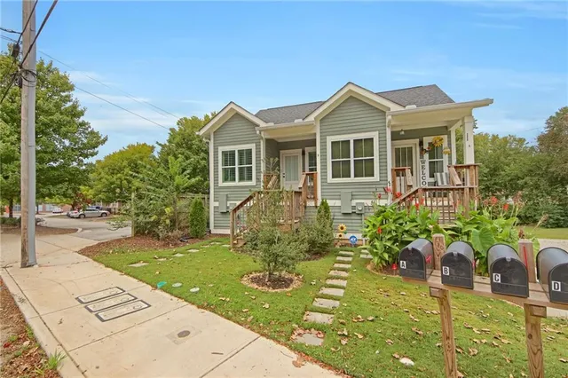 a front view of a house with garden