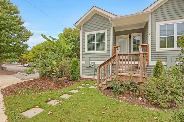 a front view of a house with garden