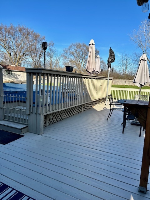 6414 Suttondale Road Huntley, IL 60142 - Photo 21 of 24 a view of a roof deck with table and chairs