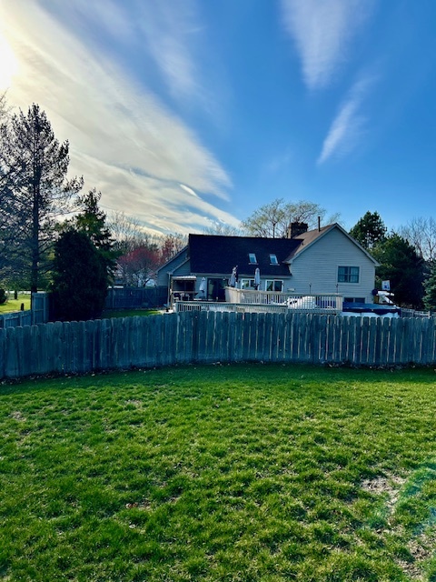 6414 Suttondale Road Huntley, IL 60142 - Photo 23 of 24 a view of a backyard with wooden fence