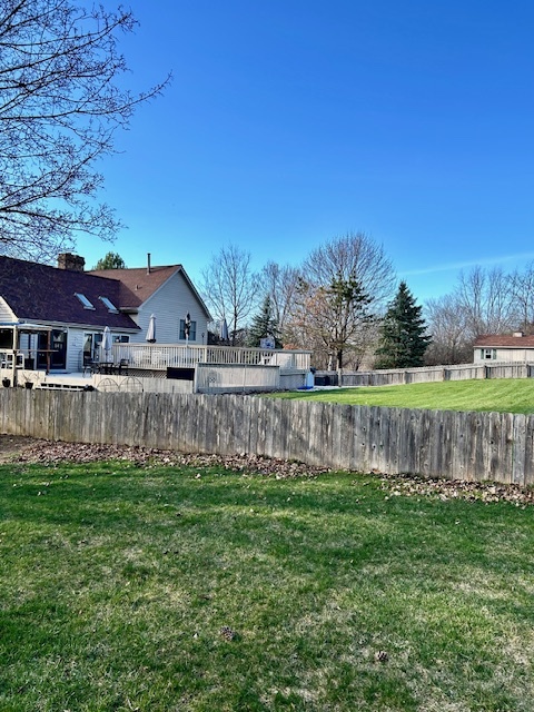 6414 Suttondale Road Huntley, IL 60142 - Photo 24 of 24 a view of a house with a yard and a large tree