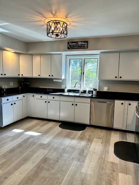 6414 Suttondale Road Huntley, IL 60142 - Photo 4 of 24 a kitchen with granite countertop a sink and a stove