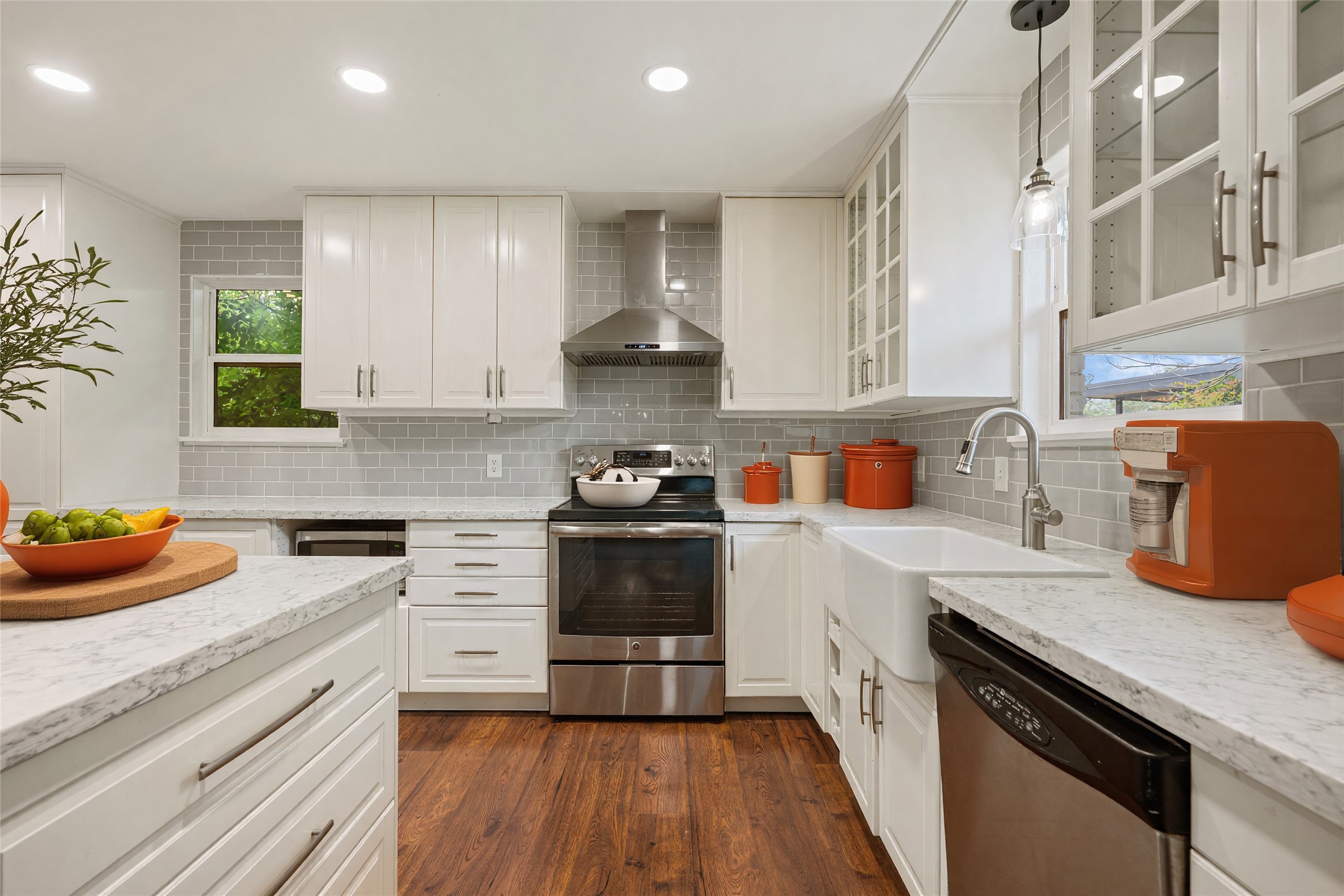 4602 Frontier Trail Austin, TX 78745 - Photo 7 of 21 A contemporary kitchen showcasing gleaming stainless steel appliances and abundant cabinetry.