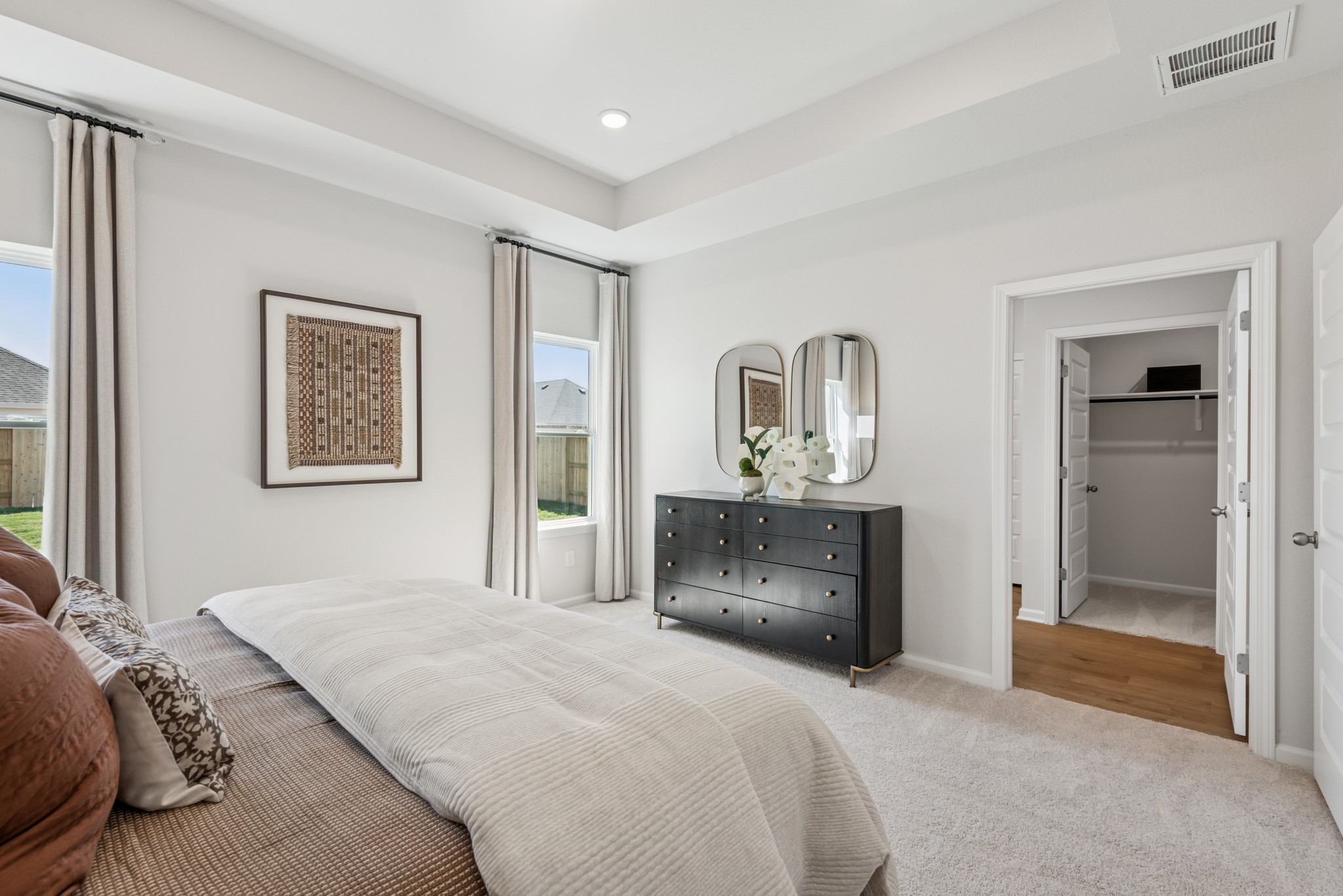 33006 School Hl Road Fulshear, TX 77441 - Photo 9 of 20 The Kettering II- Primary Bedroom Suite with Tray Ceiling. Staged model home shown for illustration only; actual features, colors, and upgrades may vary.