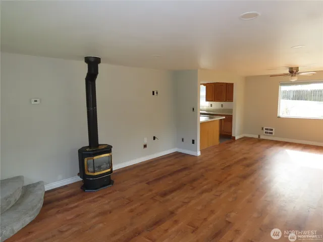 a view of a livingroom with furniture and wooden floor