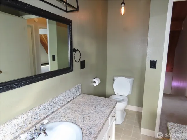 a view of an empty room with wooden walls