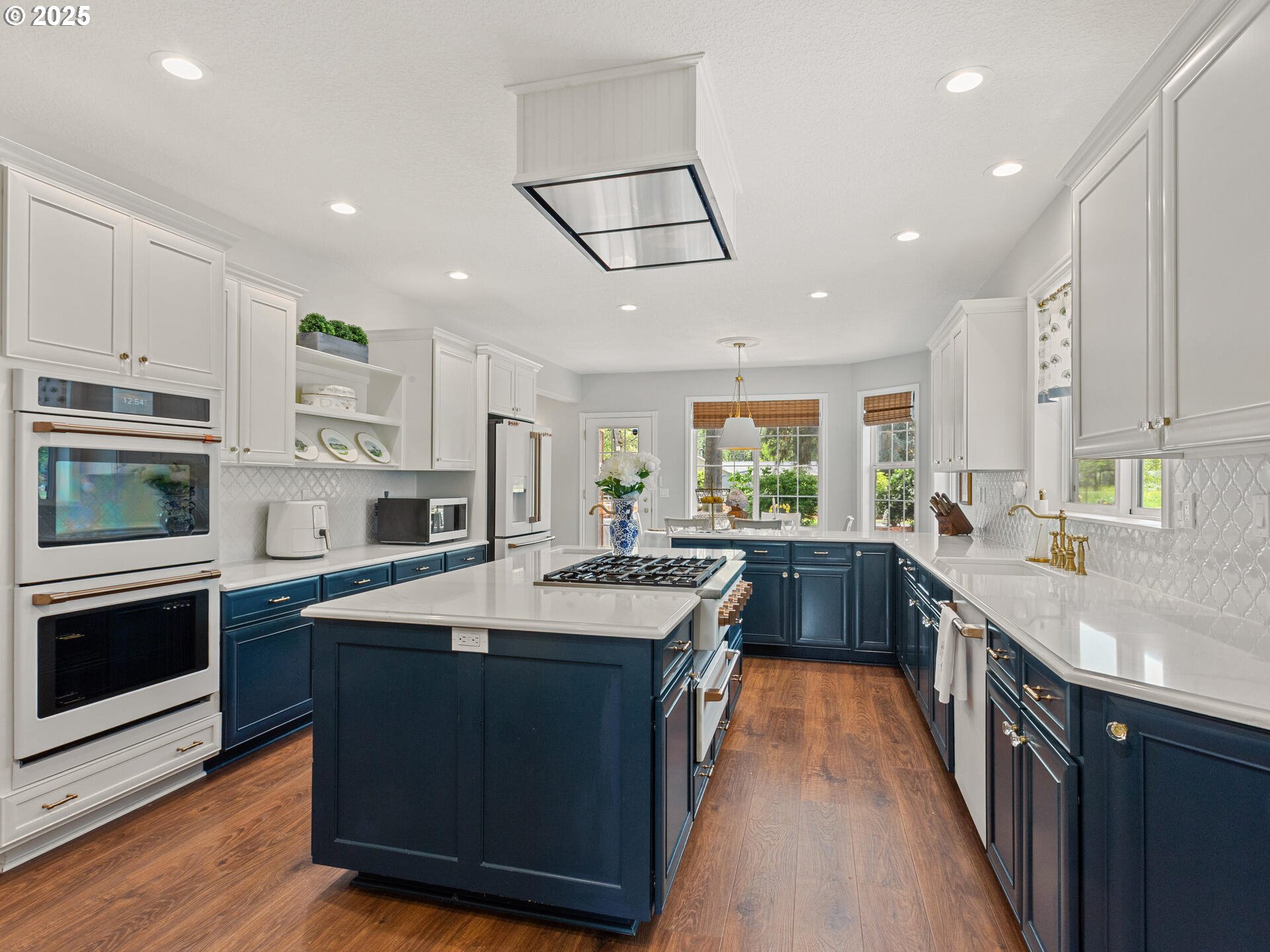 23751 Schultz Road Northeast Aurora, OR 97002 - Photo 12 of 48 a kitchen with stainless steel appliances granite countertop a stove top oven a sink dishwasher and a refrigerator
