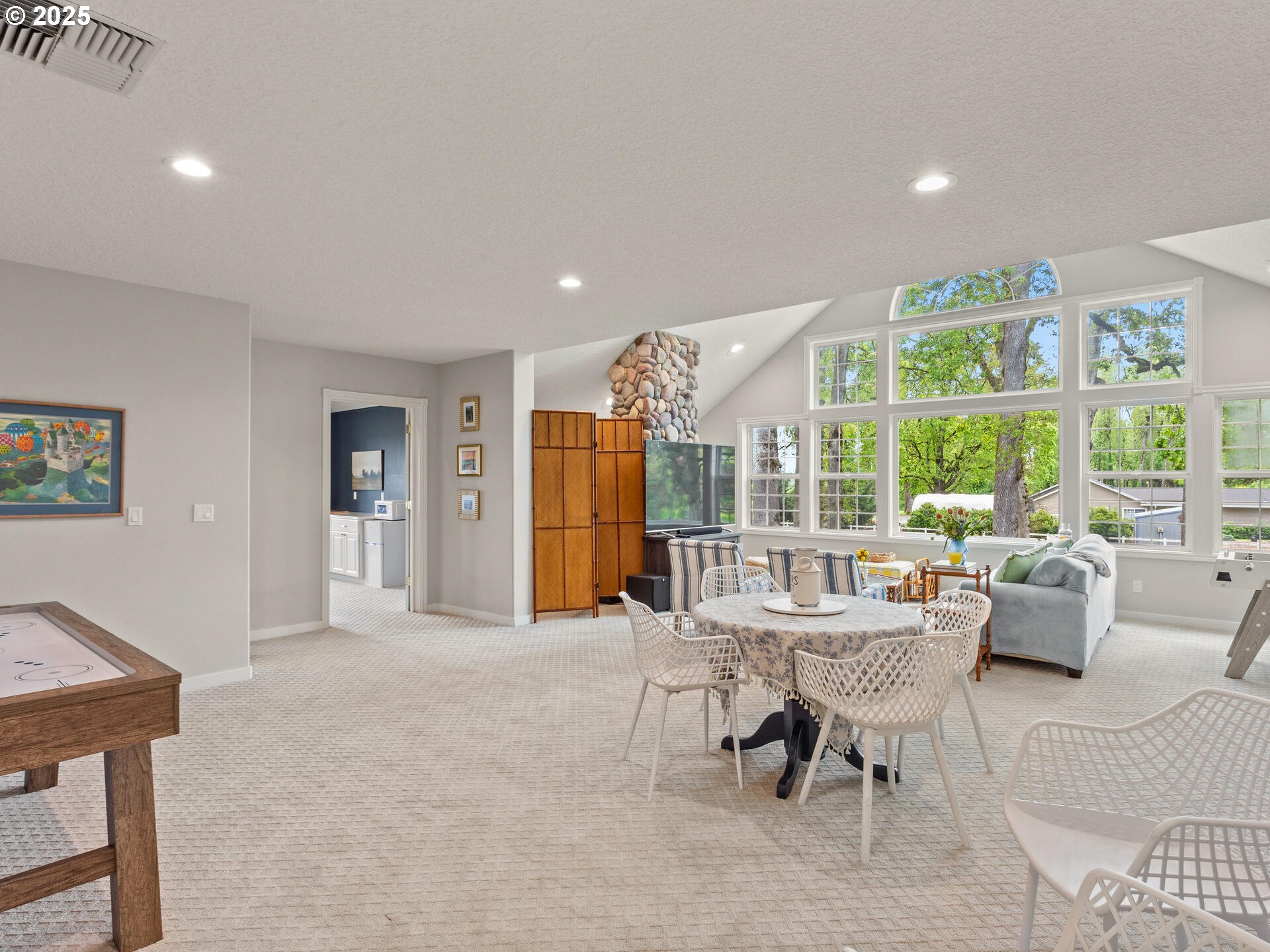 23751 Schultz Road Northeast Aurora, OR 97002 - Photo 25 of 48 a living room with furniture and a large window