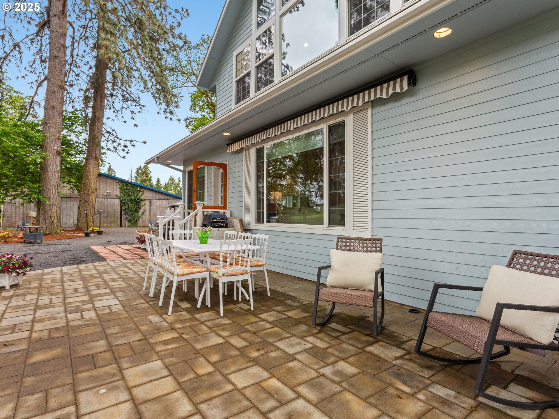 23751 Schultz Road Northeast Aurora, OR 97002 - Photo 34 of 48 a backyard of a house with table and chairs