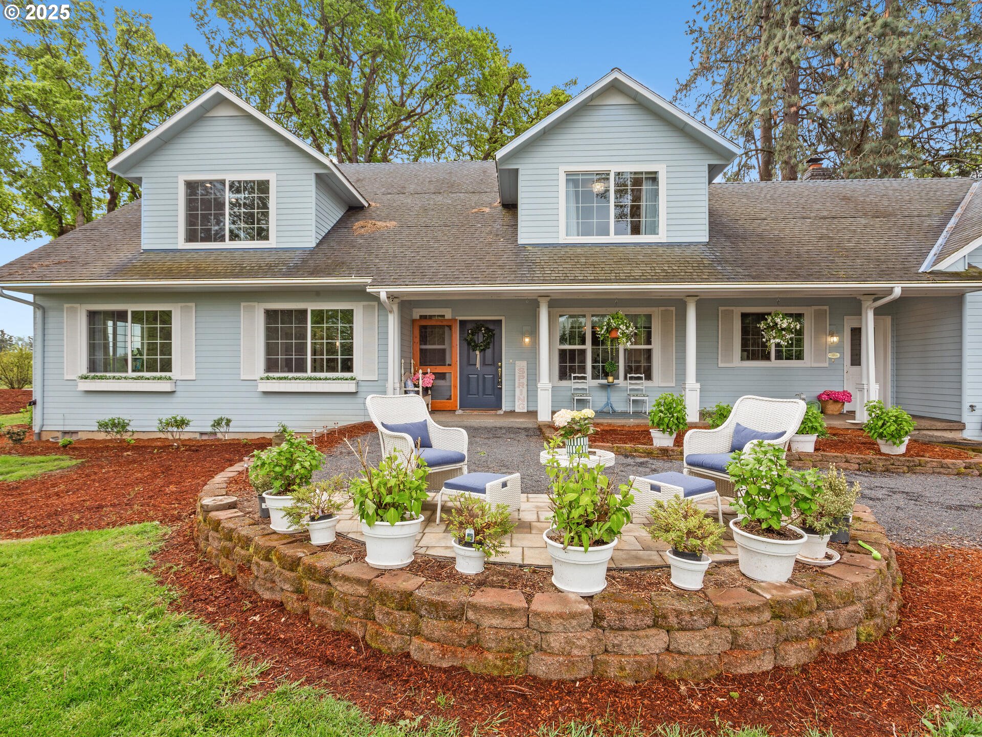 23751 Schultz Road Northeast Aurora, OR 97002 - Photo 5 of 48 a front view of a house with a yard and outdoor seating