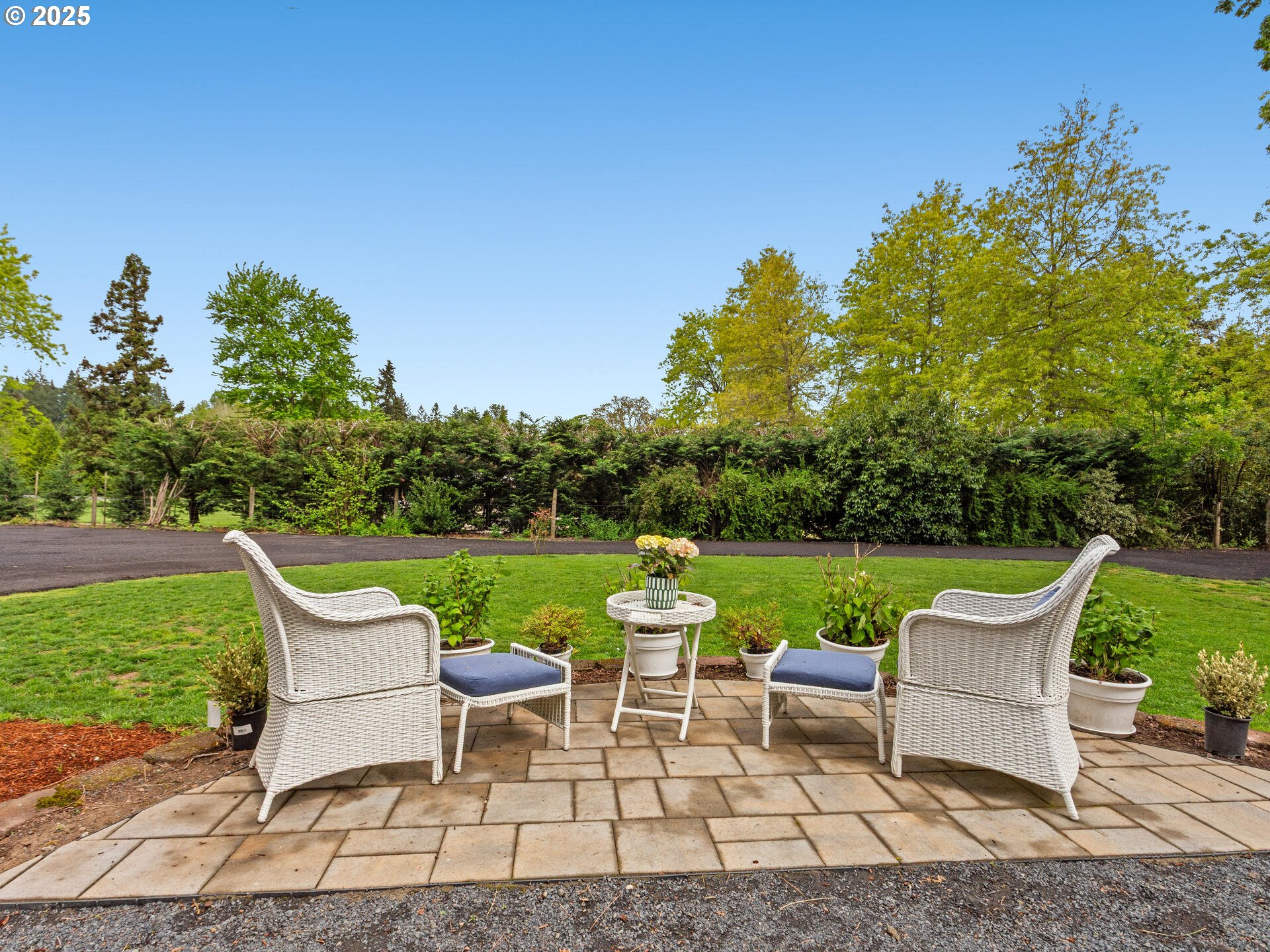 23751 Schultz Road Northeast Aurora, OR 97002 - Photo 6 of 48 a view of a garden with chairs and table in the patio