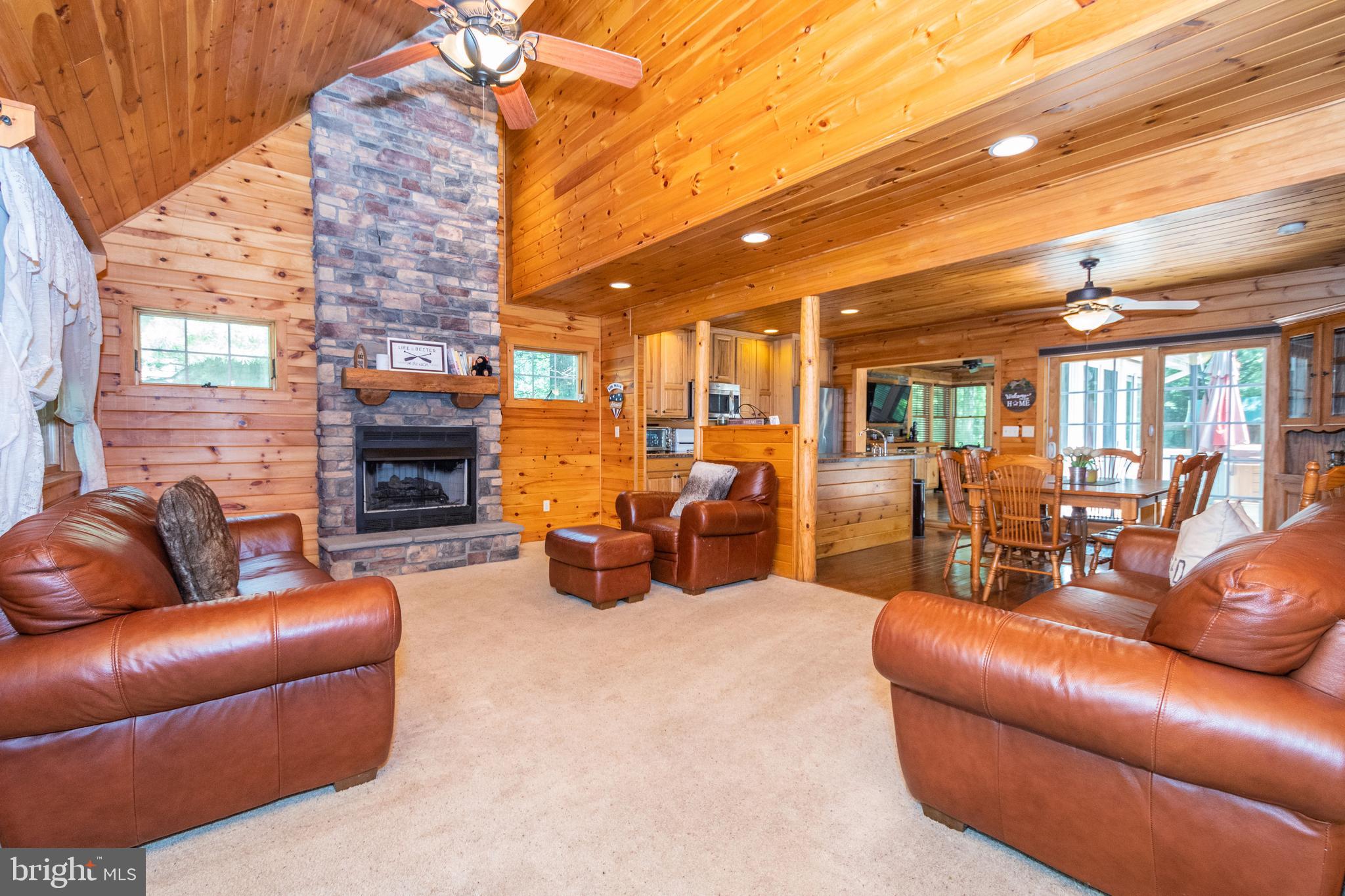 302 Oak Way Road Swanton, MD 21561 - Photo 15 of 56 a view of a livingroom with furniture and a fireplace