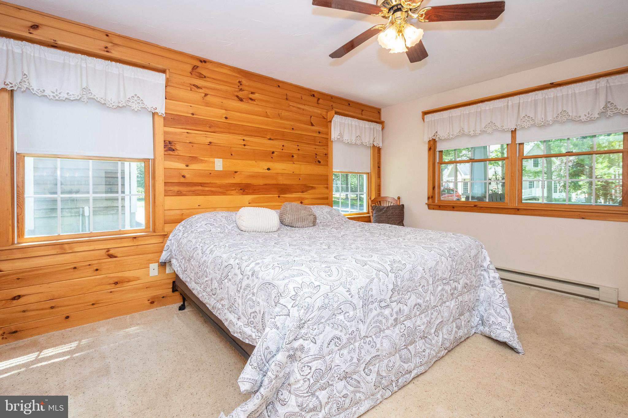 302 Oak Way Road Swanton, MD 21561 - Photo 23 of 56 a bedroom with a bed and window