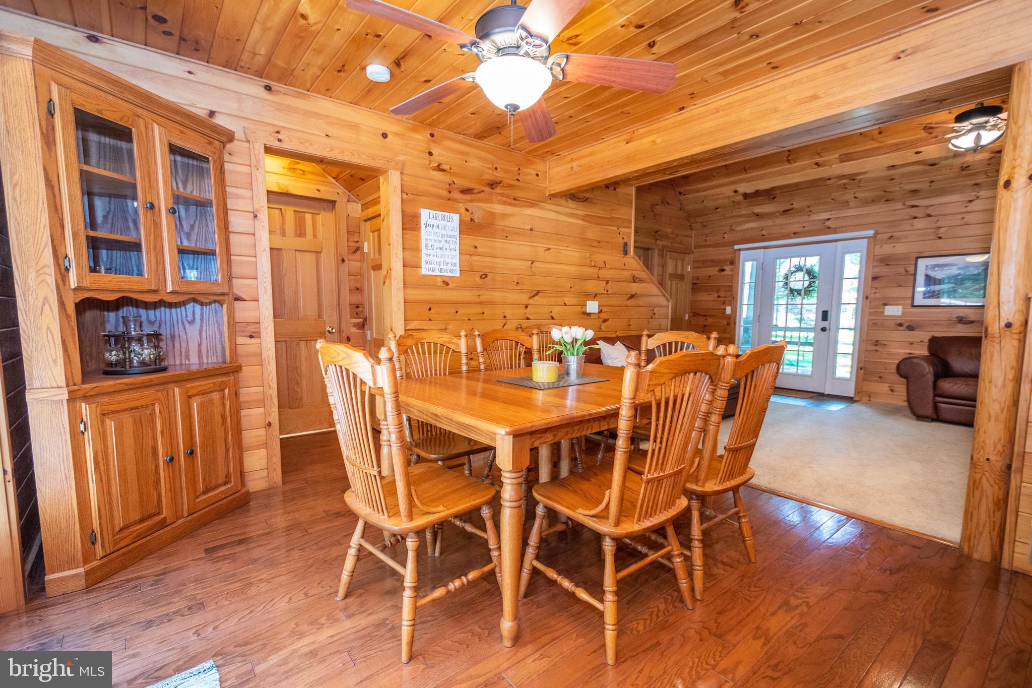 302 Oak Way Road Swanton, MD 21561 - Photo 4 of 56 a dining room with furniture and wooden floor