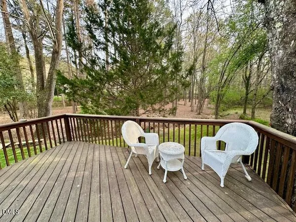 a view of a deck patio and outdoor seating
