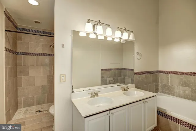 a bathroom with a bathtub and sink