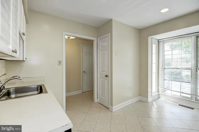 a kitchen with stainless steel appliances granite countertop a stove and a refrigerator