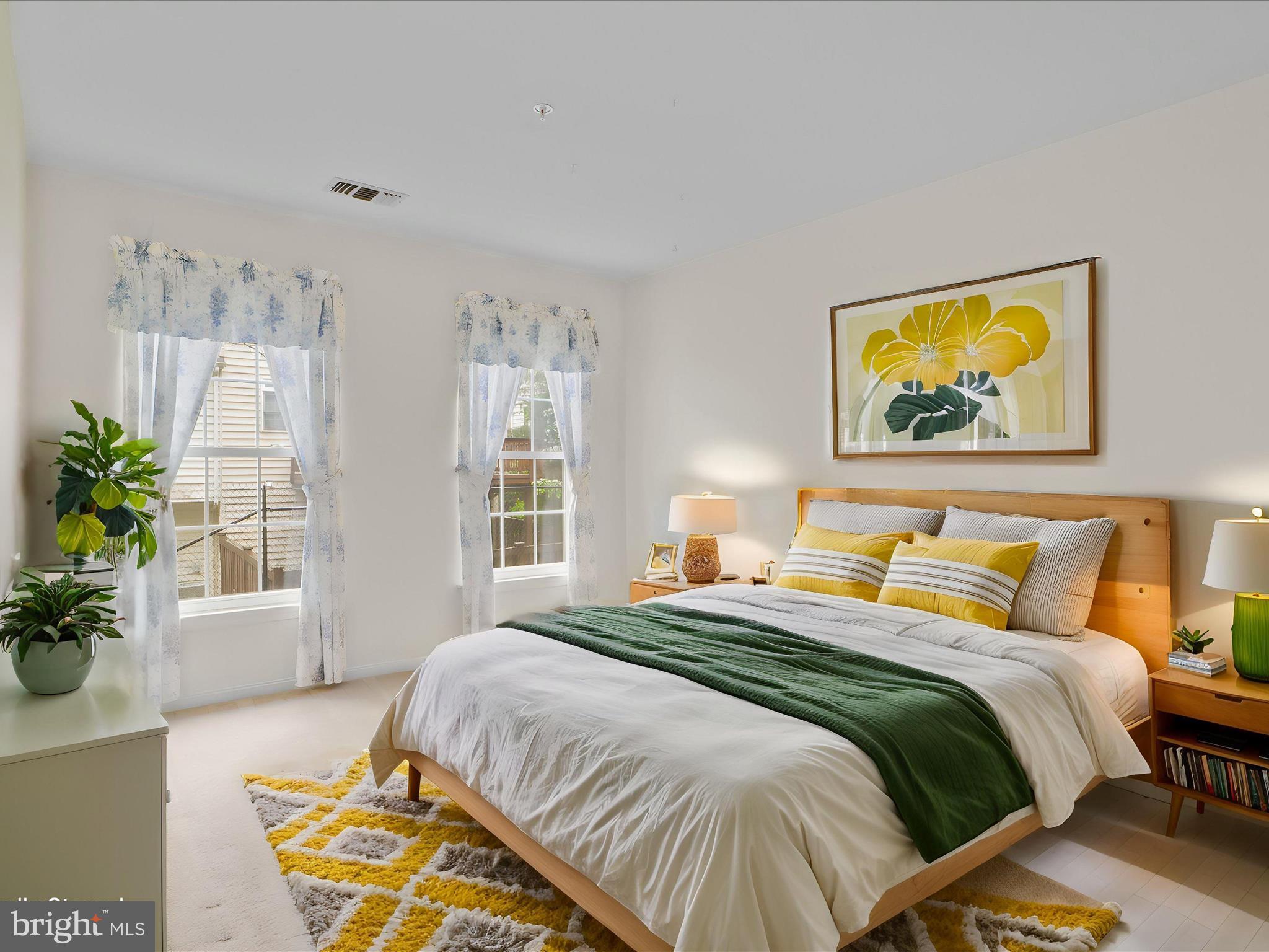 4574 Superior Square Fairfax, VA 22033 - Photo 19 of 44 a spacious bedroom with a bed and a painting on the wall