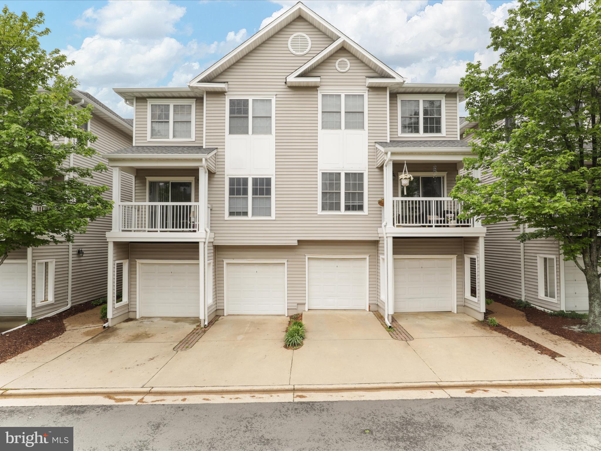 4574 Superior Square Fairfax, VA 22033 - Photo 29 of 44 a front view of a house with garage and parking
