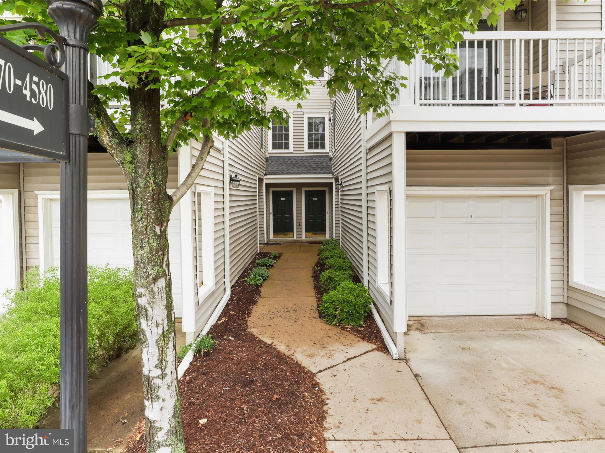 4574 Superior Square Fairfax, VA 22033 - Photo 30 of 44 a front view of a house with a yard
