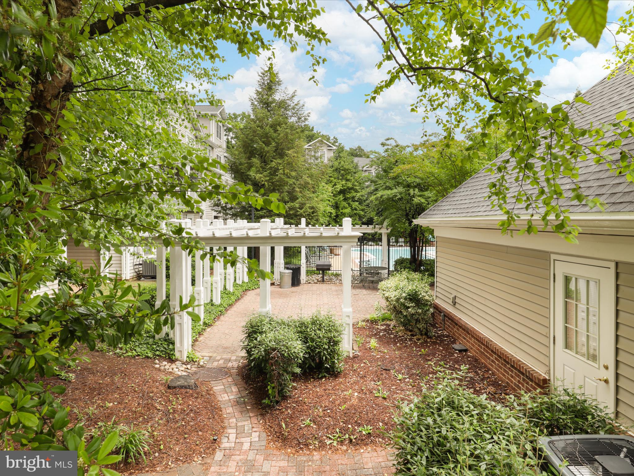 4574 Superior Square Fairfax, VA 22033 - Photo 33 of 44 a front view of a house with a yard