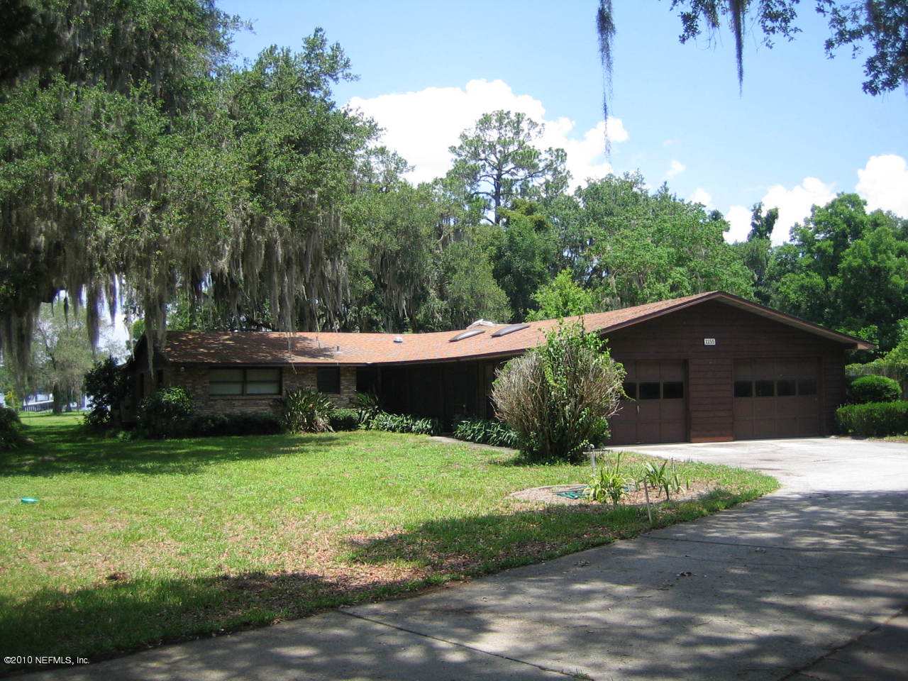 1155 Popolee Road St. Johns, FL 32259 - Photo 2 of 29 a view of house with yard and green space