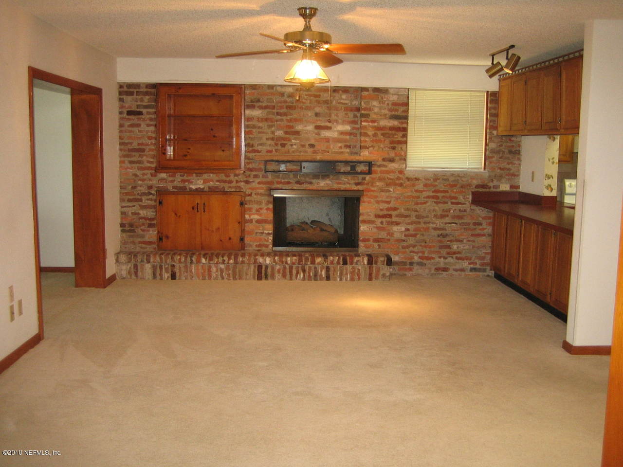 1155 Popolee Road St. Johns, FL 32259 - Photo 7 of 29 a view of a livingroom with a fireplace and a window