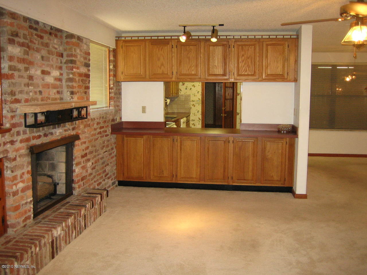 1155 Popolee Road St. Johns, FL 32259 - Photo 8 of 29 a view of kitchen with wooden floor and windows