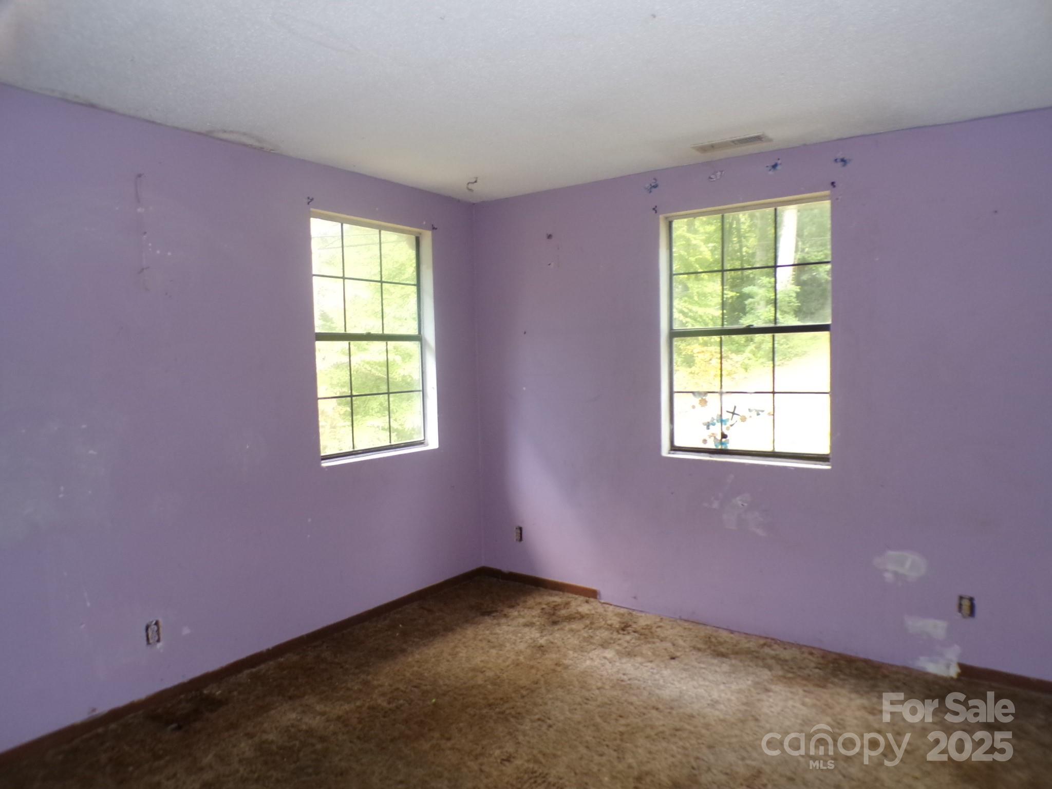 620 Hutch Mountain Road Fletcher, NC 28732 - Photo 11 of 22 an empty room with a window