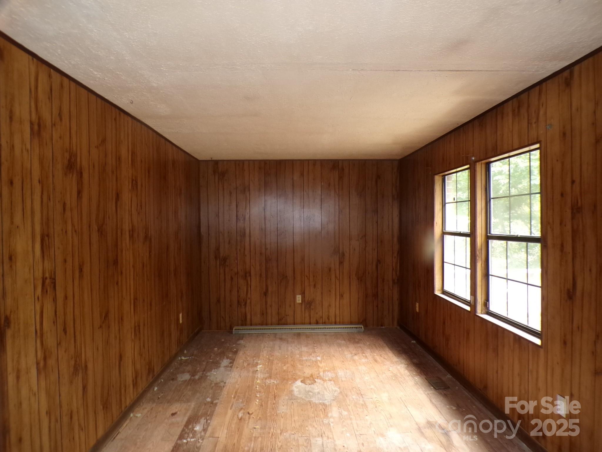 620 Hutch Mountain Road Fletcher, NC 28732 - Photo 17 of 22 an empty room with windows