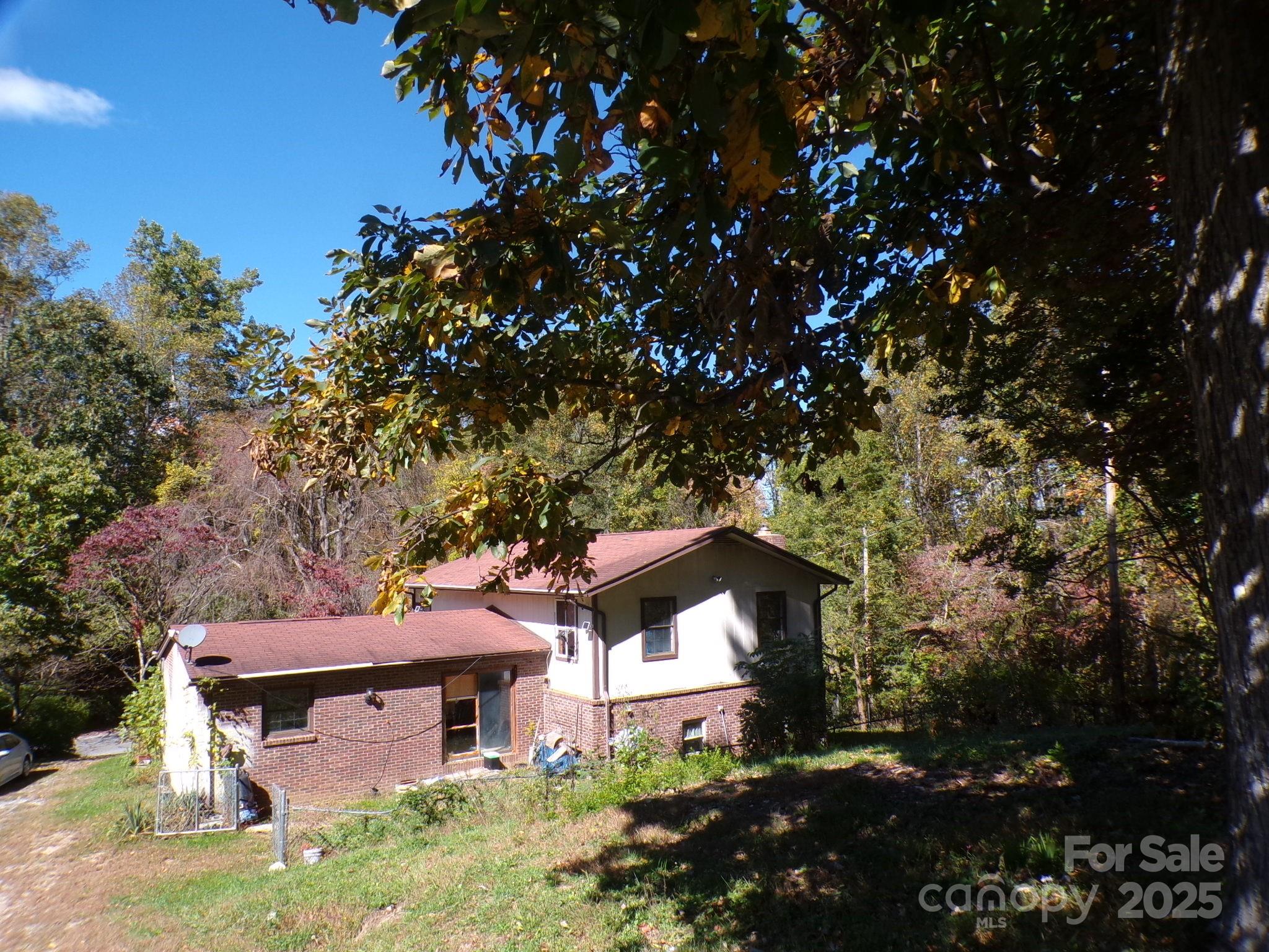 620 Hutch Mountain Road Fletcher, NC 28732 - Photo 20 of 22 a front view of a house with a tree