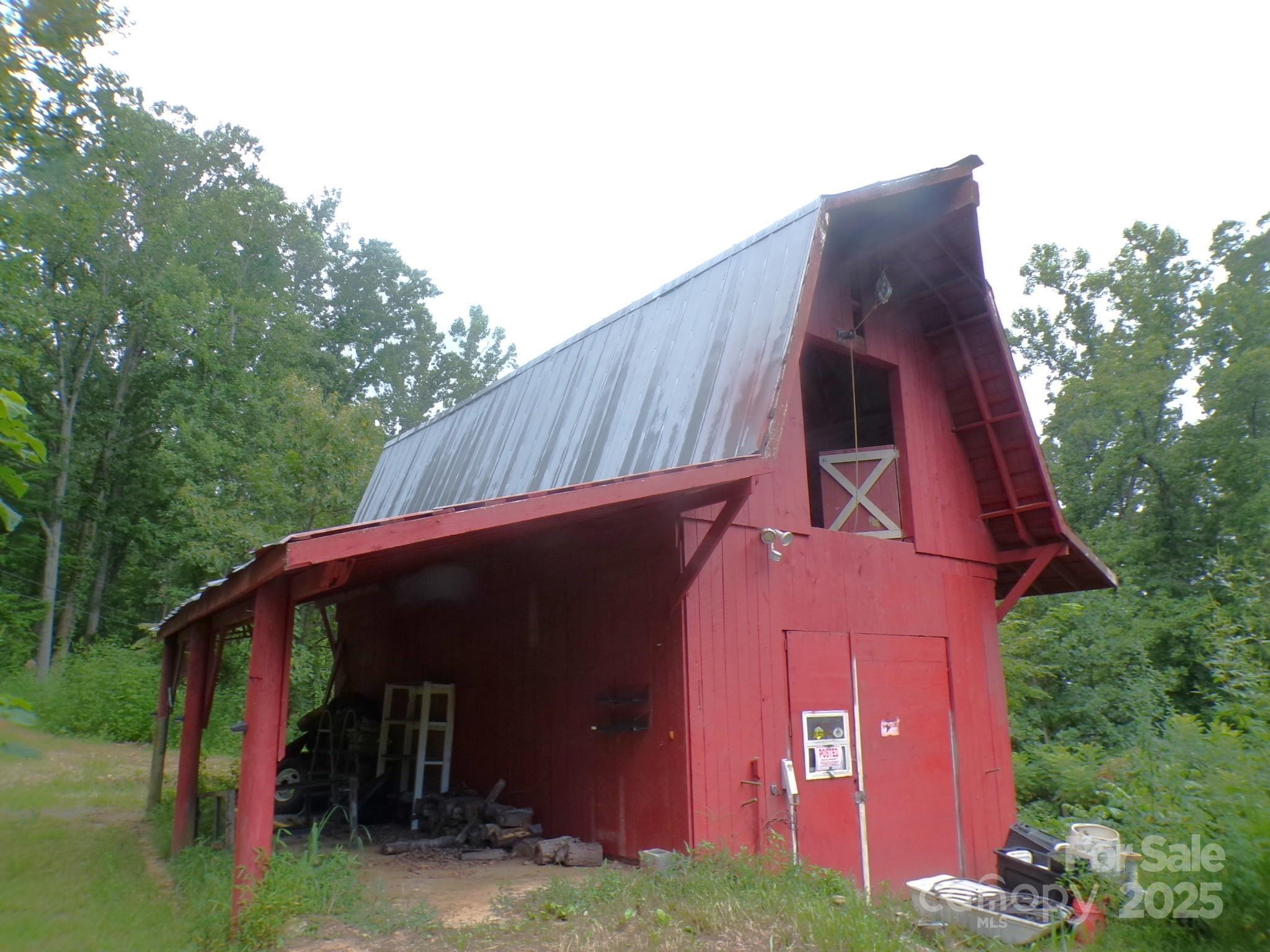 620 Hutch Mountain Road Fletcher, NC 28732 - Photo 2 of 22 a view of a small house