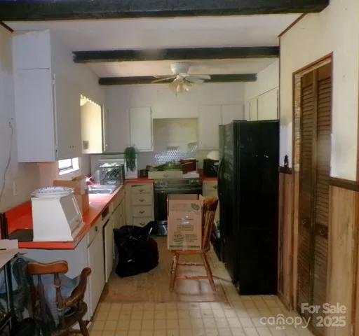 a kitchen with a refrigerator and a cabinets