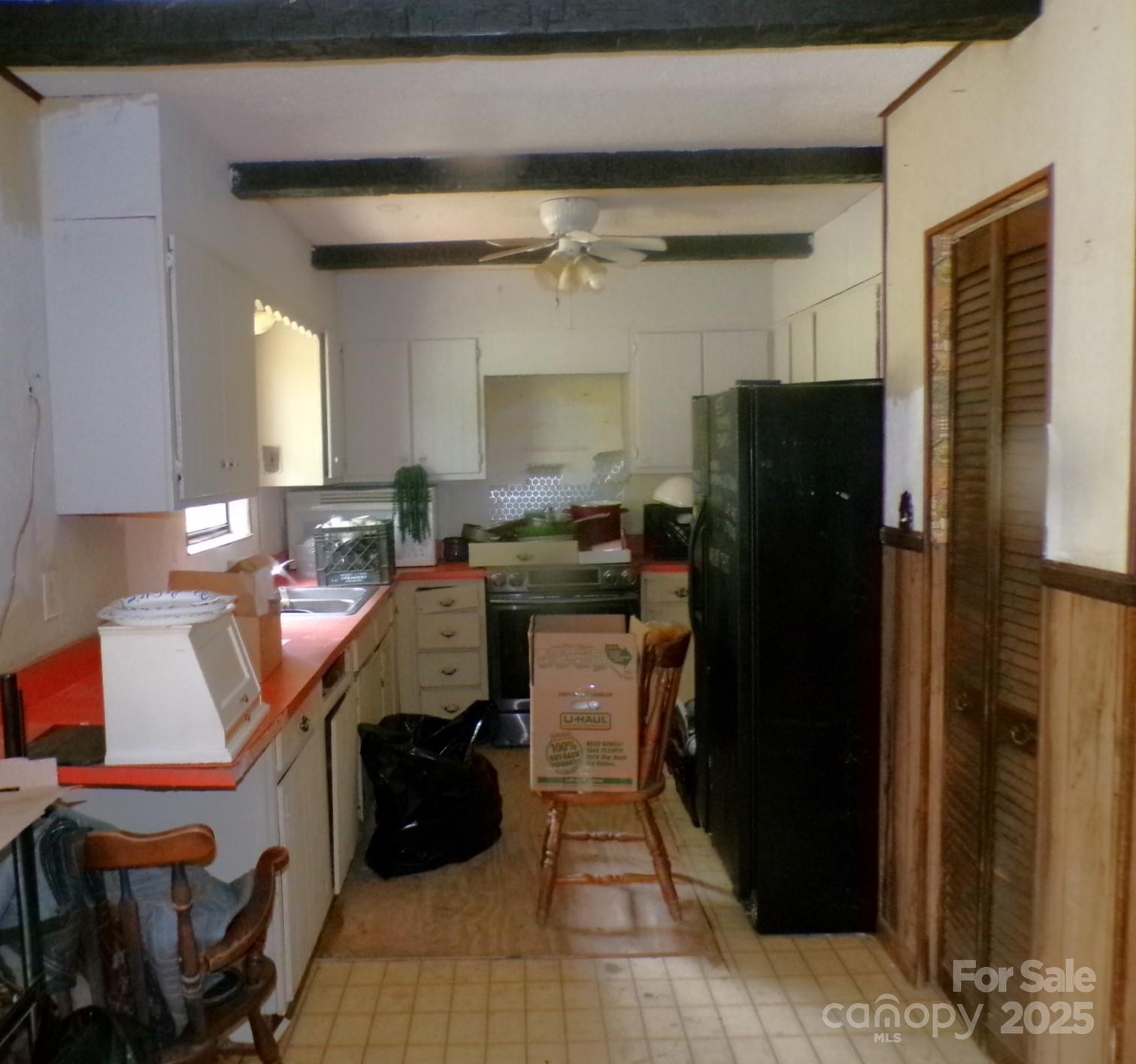 620 Hutch Mountain Road Fletcher, NC 28732 - Photo 8 of 22 a kitchen with a refrigerator and a cabinets