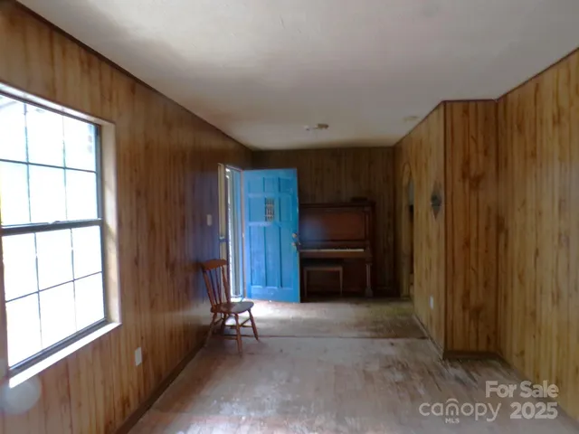 a view of kitchen and refrigerator