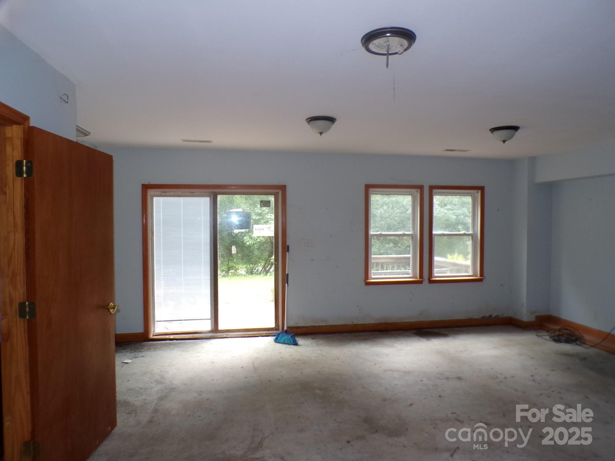 620 Hutch Mountain Road Fletcher, NC 28732 - Photo 10 of 22 an empty room with windows