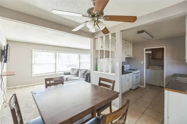a view of a dining room with furniture and window