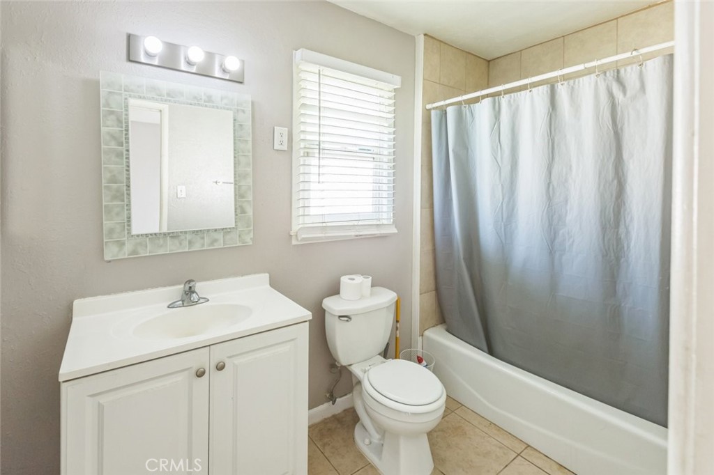 15917 Lee Street Mojave, CA 93501 - Photo 17 of 34 a bathroom with a sink a toilet and shower