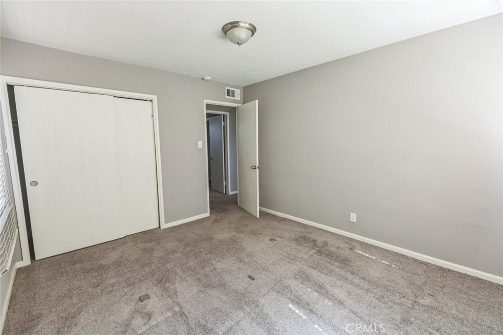 15917 Lee Street Mojave, CA 93501 - Photo 21 of 34 an empty room with closet area